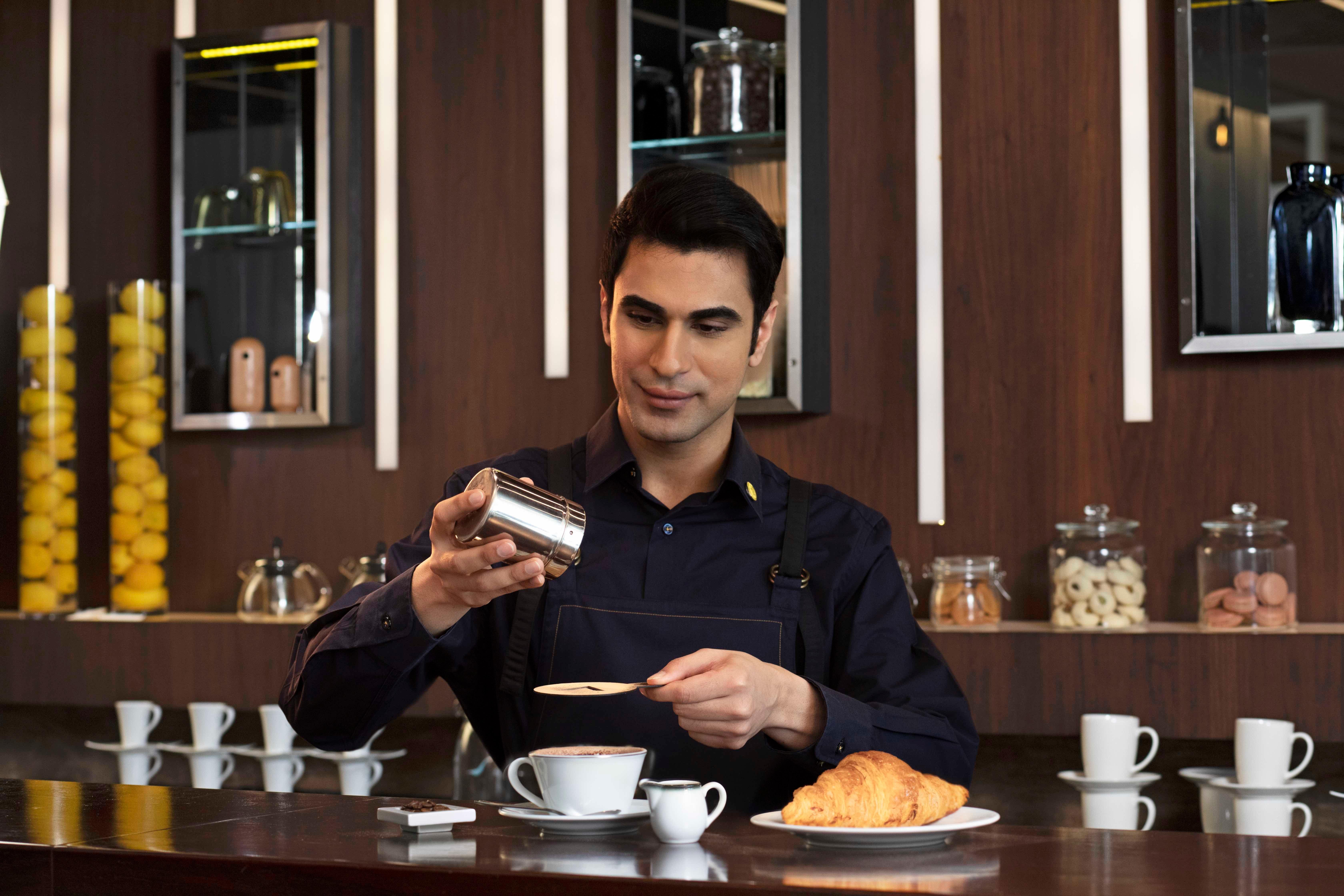 Voco Dubai By Ihg Hotel Exterior photo A barista at work